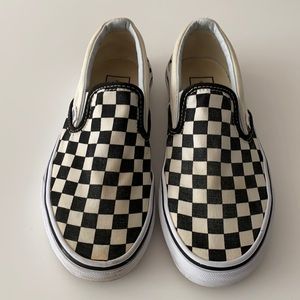 Black and white checkered Vans. Size 5.5 Men and 7.0 Women.